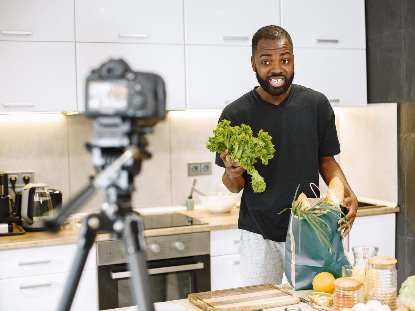 A man preparing fresh vegetables in a kitchen