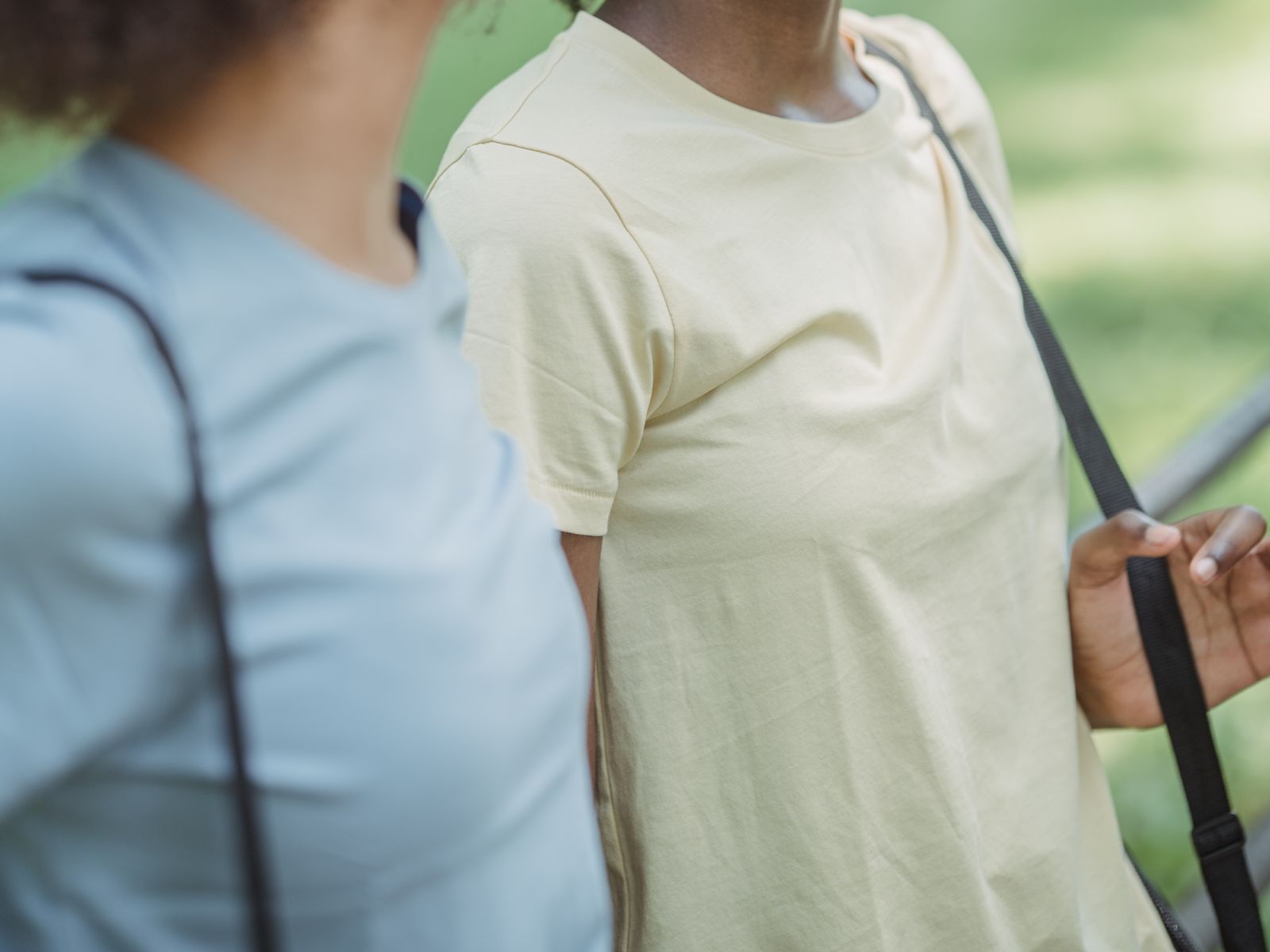Two people walking and talking together outdoors